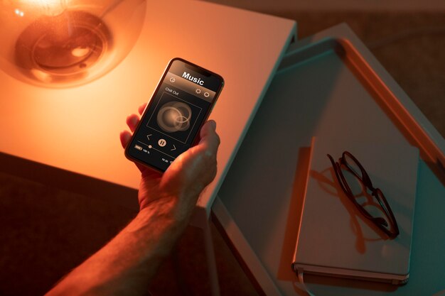 Man using a smartphone in his automated home