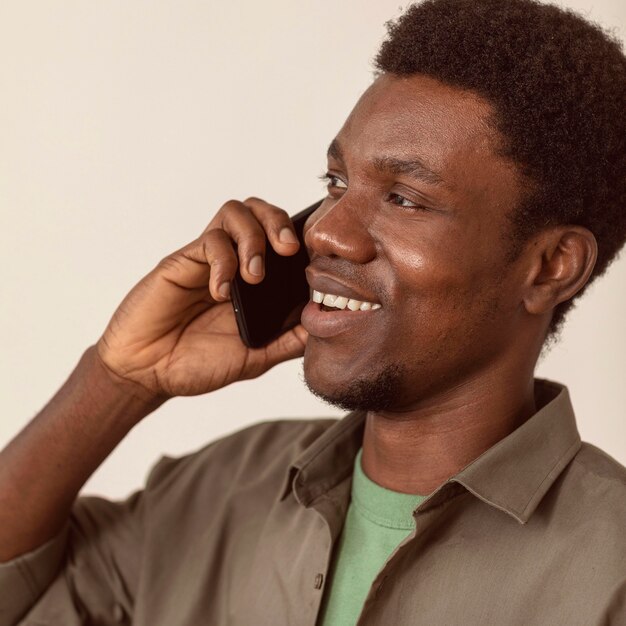 Man using smartphone and talking close-up