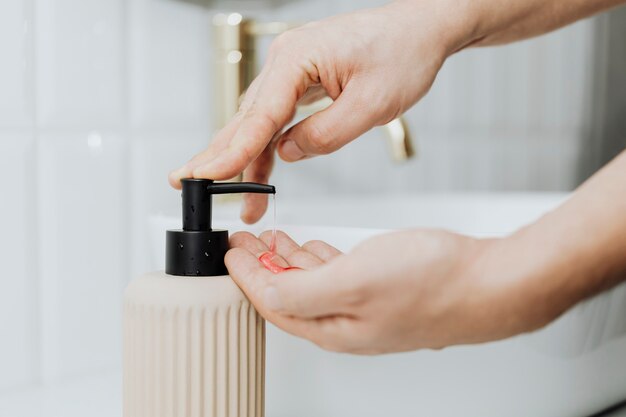 Man using a soap dispenser