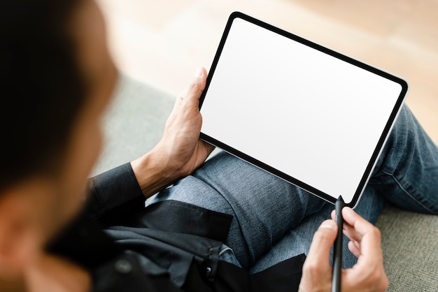 Man using stylus with digital tablet