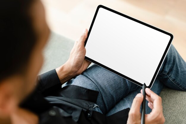 Man using stylus with digital tablet