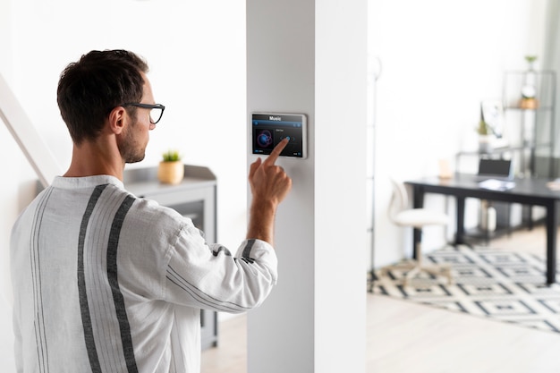 Man using a tablet in his smart home