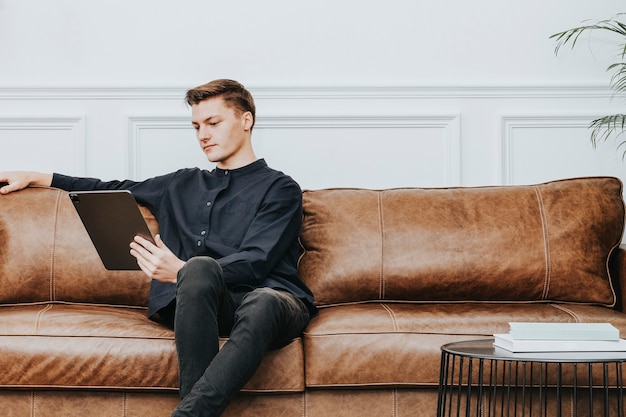 Man using a tablet and working from home