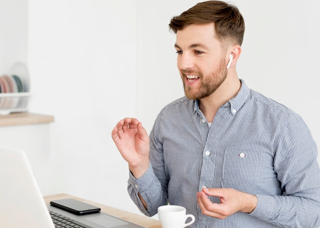 Man video call on laptop