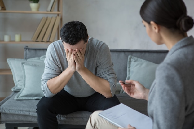Man visit psychologist meantal health care stress