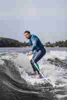 Free photo man on wakesurfing. wave from the boat.