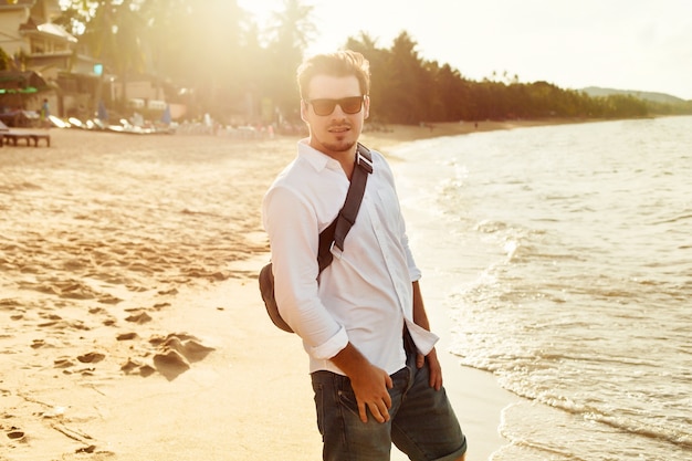 Man walking along the seashore