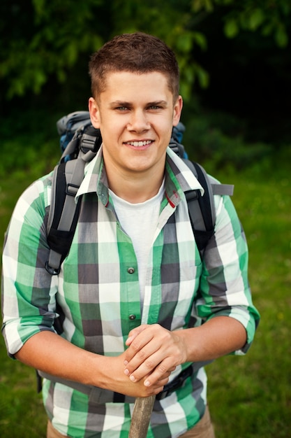 Free photo man walking through forest