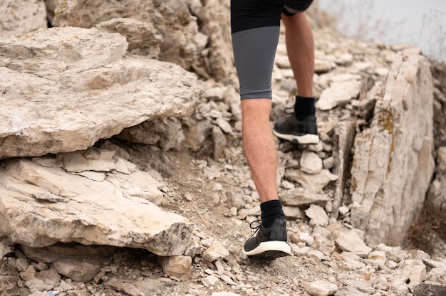 Man walking through rocks in nature