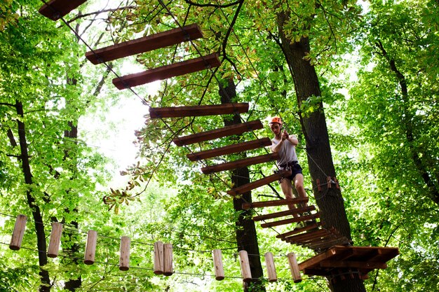 Man walks on the rope path in the air