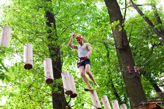 Man walks on the rope path in the air