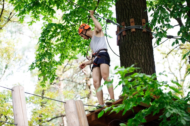 Man walks on the rope path in the air