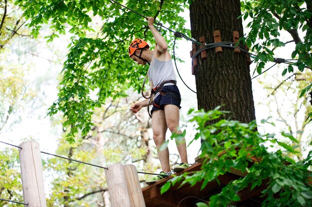 Man walks on the rope path in the air