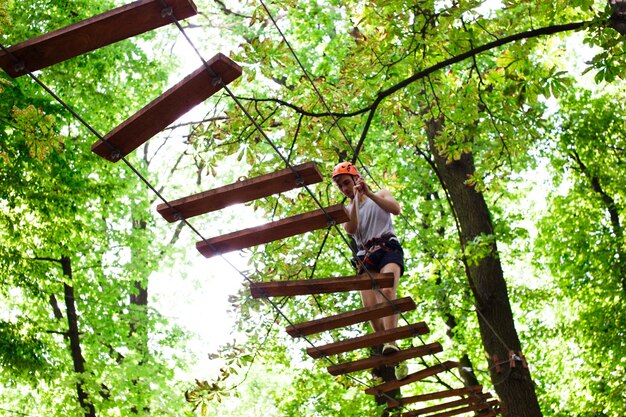 Man walks on the rope path in the air