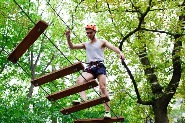 Man walks on the rope path in the air