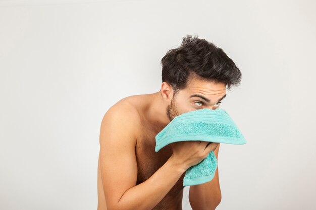 Man washing his face