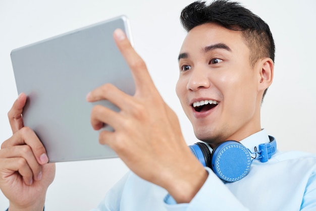 man watching Great news on tablet pc