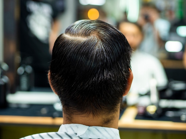 Man watching himself in blurred mirror