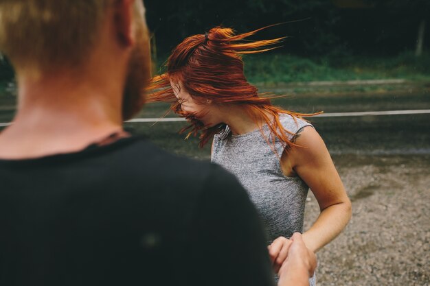 Man watching his girlfriend shaking her head