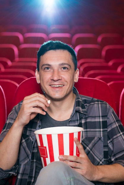 Man watching movie in cinema