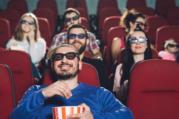 Man watching movie in full cinema