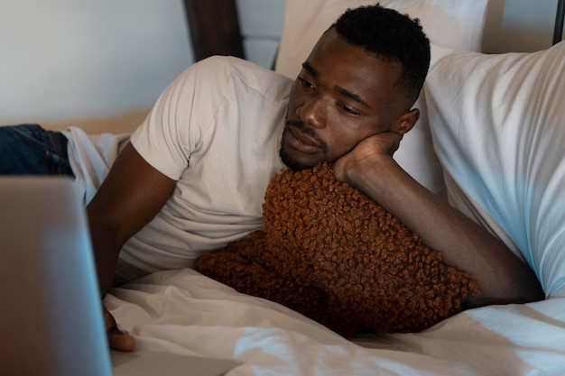 Man watching a movie on streaming service at home