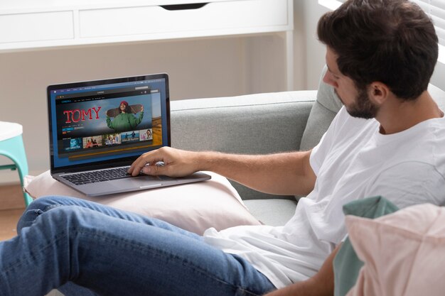 Man watching streaming service on his laptop