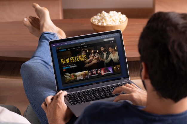 Man watching streaming service on his laptop