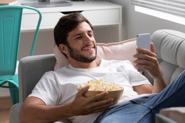 Man watching streaming service on his phone
