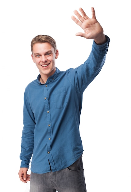 Man waving hand while smiling