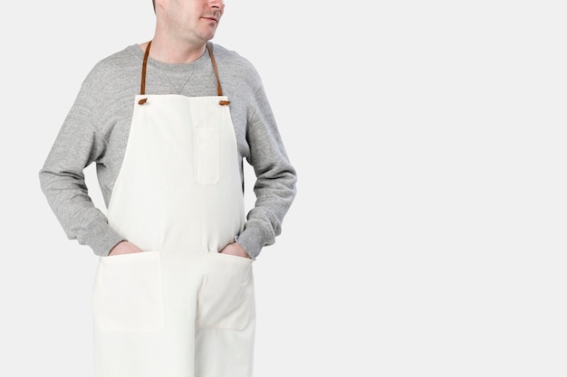 Free photo man wearing beige apron close-up