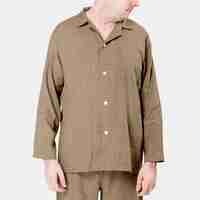 Free photo man wearing beige pajamas sleepwear