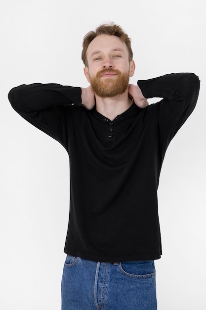 Man wearing black blank shirt medium shot