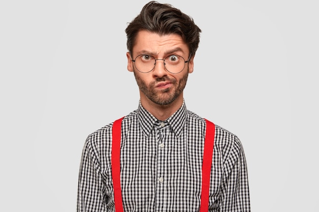 Free photo man wearing checkered shirt and red suspenders