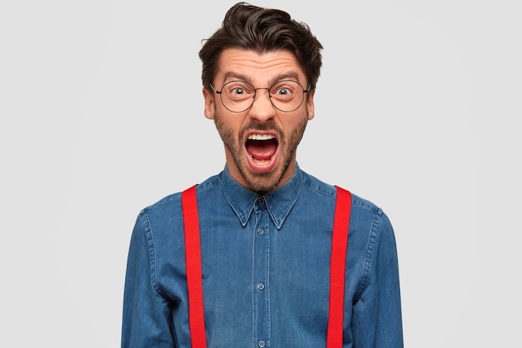 Free Photo man wearing denim shirt and red suspenders