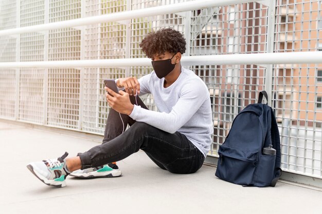 Man wearing face mask full shot