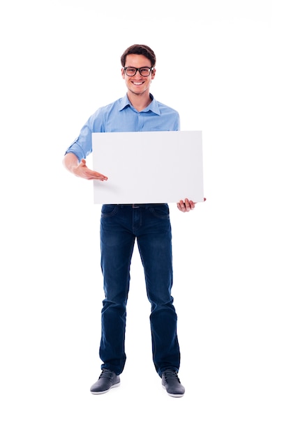 Free photo man wearing glasses holding white board