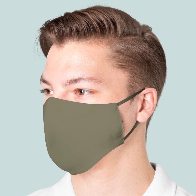 Man wearing green fabric mask for COVID-19 protection campaign