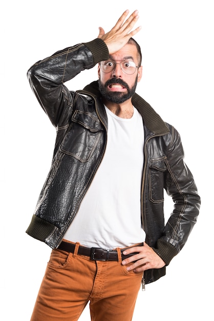 Man wearing a leather jacket having doubts