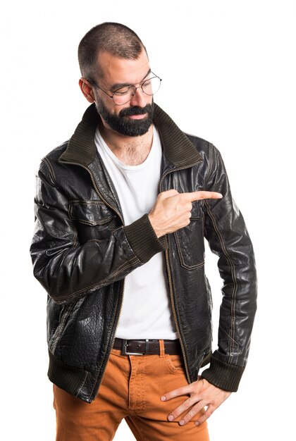 Man wearing a leather jacket pointing to the lateral