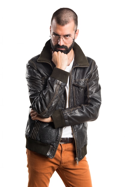 Man wearing a leather jacket thinking
