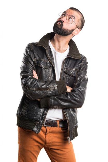 Man wearing a leather jacket thinking