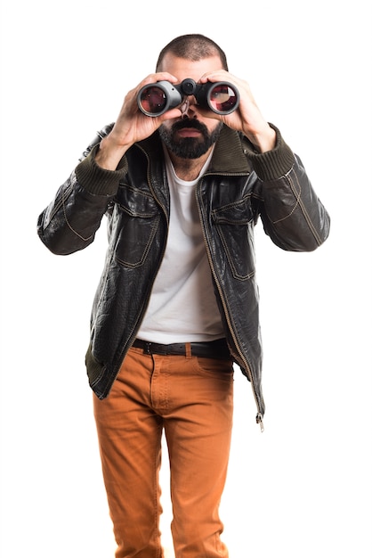 Man wearing a leather jacket with binoculars