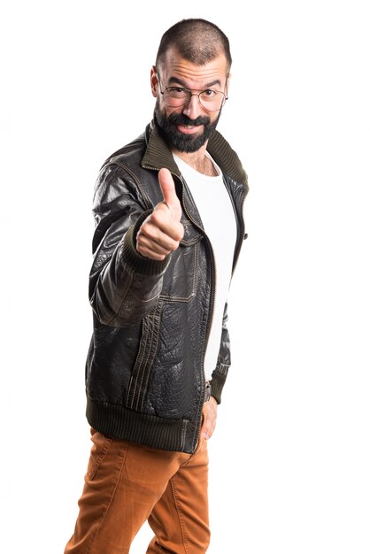 Man wearing a leather jacket with thumb up