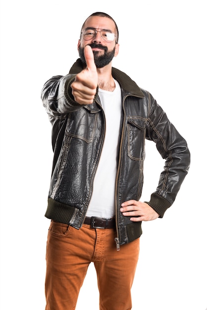Man wearing a leather jacket with thumb up