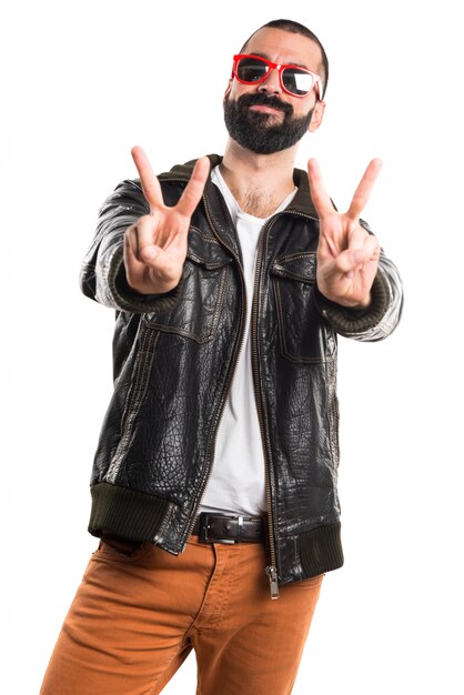 Man wearing a leather jacket with thumb up