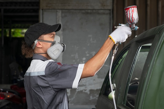 Free photo man wearing protection equipment side view