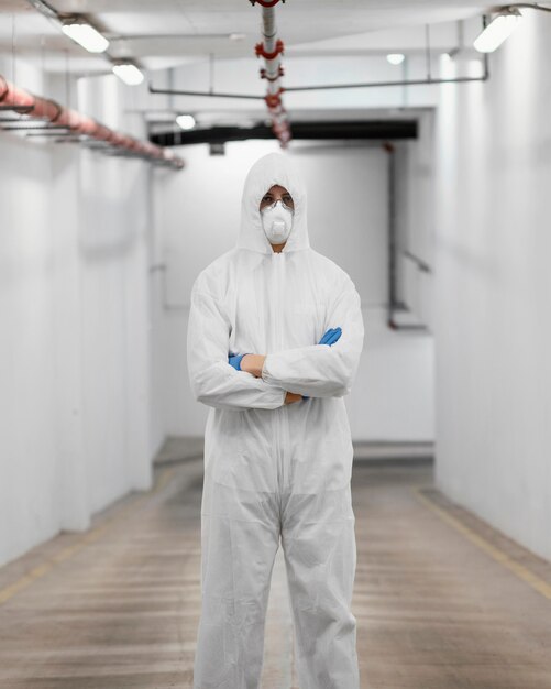 Man wearing a protective equipment against a bio-hazard