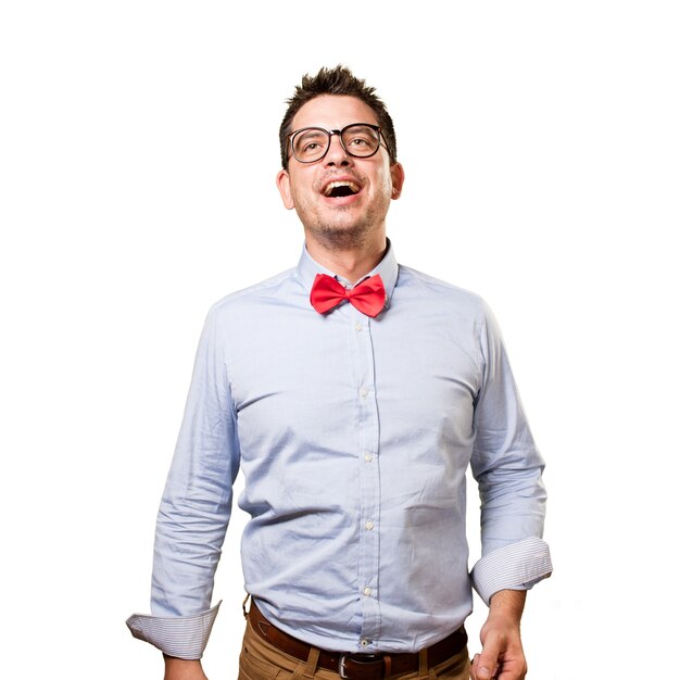 Man wearing a red bow tie. Looking happy.