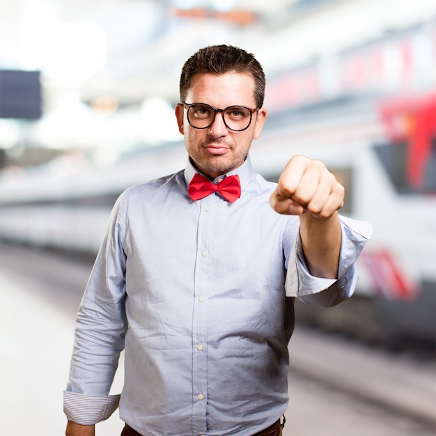 Free photo man wearing a red bow tie. looking serious.